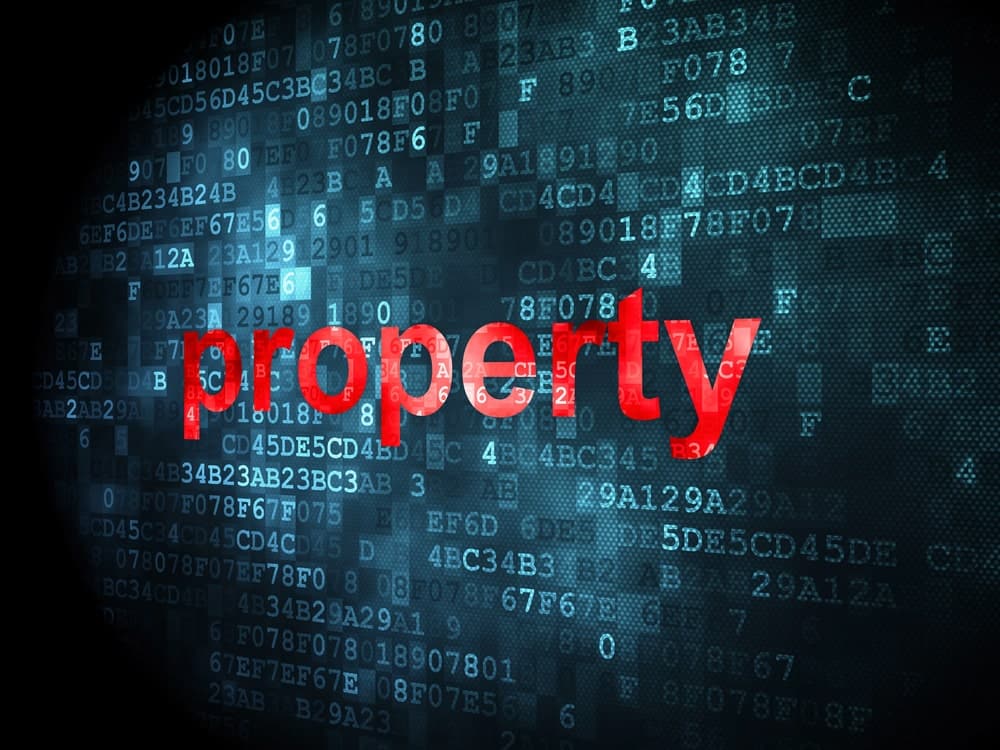 Image is of the word property highlighted against a digital data background, concept of financial records review in asset investigations.